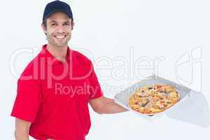 Happy delivery man holding fresh pizza