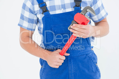 Repairman holding adjustable pliers