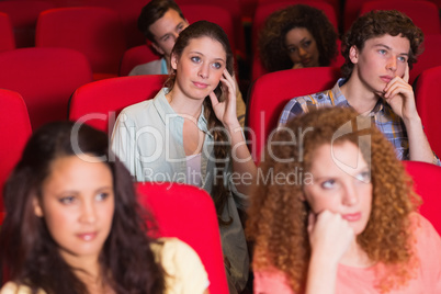 Young friends watching a film