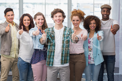 Fashion students smiling at camera together