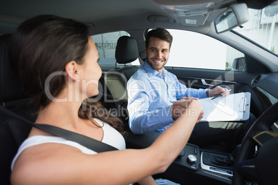 Young woman getting a driving lesson