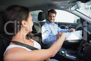 Young woman getting a driving lesson