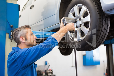 Mechanic adjusting the tire wheel