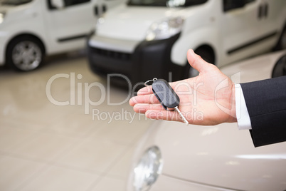 Close up of businessman holding car key