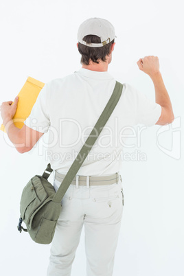 Delivery man with envelop knocking on white background