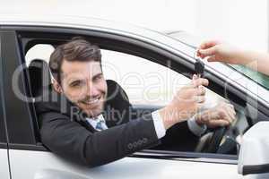 Businessman sitting in drivers seat