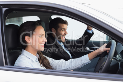 Business team smiling and driving