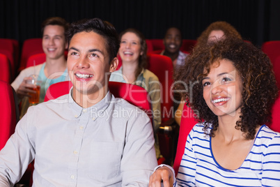 Young couple watching a film