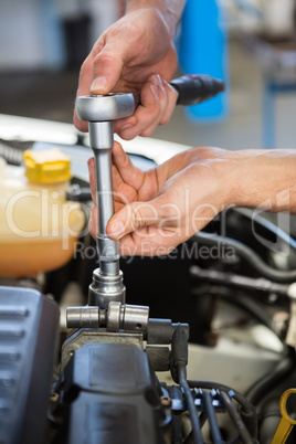 Mechanic working under the hood