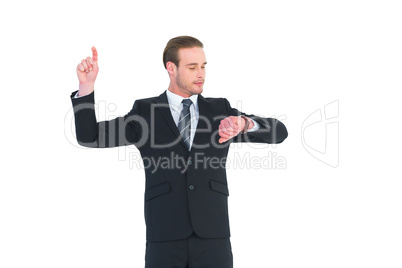 Businessman man checking time pointing up with finger