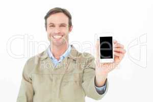 Smiling delivery man showing smart phone