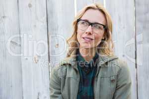 Blonde in glasses posing and thinking