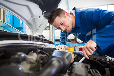 Mechanic working under the hood