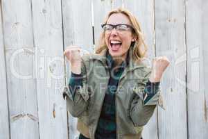Blonde in glasses shouting and cheering