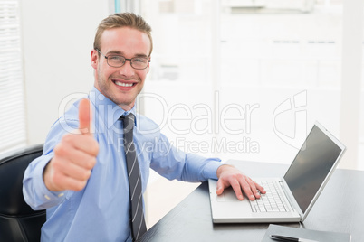 Positive businessman with glasses and thumb up