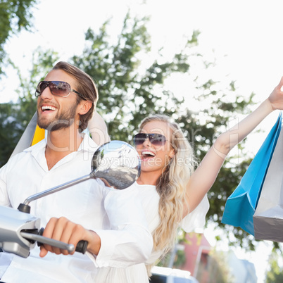 Cute couple riding a scooter