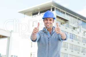 Confident male architect showing double thumbs up