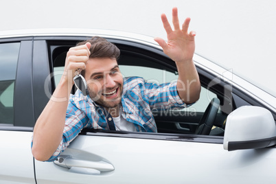 Young man smiling and waving