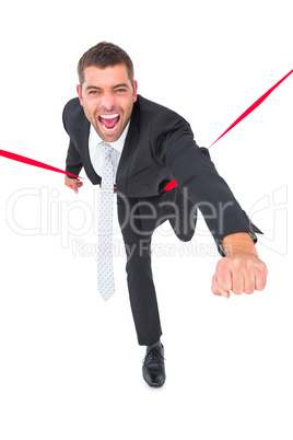 Businessman crossing the finish line