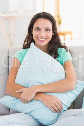 Pretty brunette relaxing on the couch