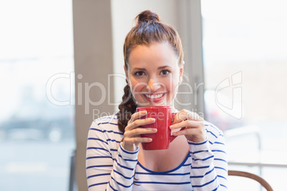 Young woman having a coffee