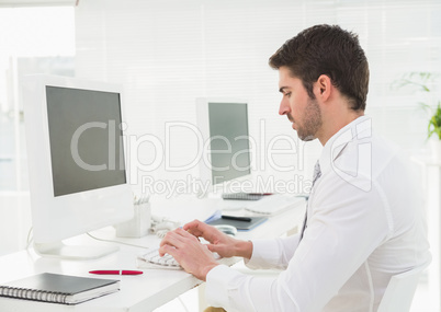 Classy businessman typing on keyboard