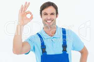 Smiling carpenter showing OK sign