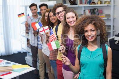 Happy students waving international flags