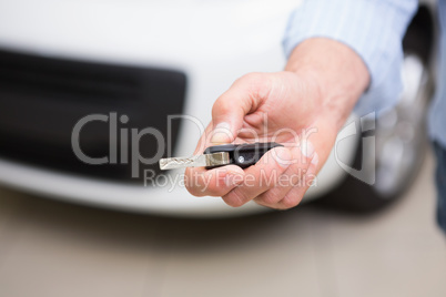 Close up of customer holding his new car key