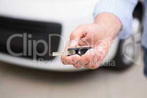 Close up of customer holding his new car key