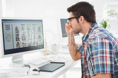 Focused businessman using computer monitor