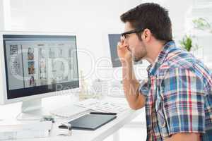 Focused businessman using computer monitor