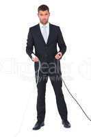 Serious businessman holding cables to connect