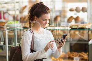 Pretty brunette sending a text