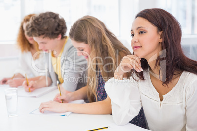 Fashion students taking notes in class