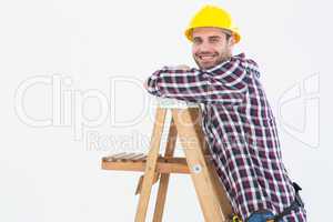 Smiling repairman climbing ladder