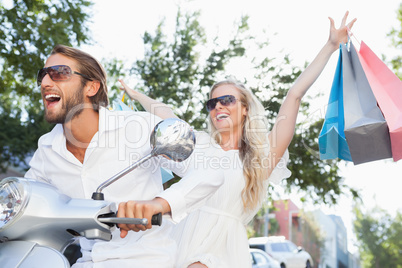 Cute couple riding a scooter