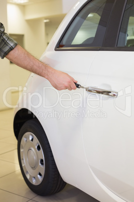 Man opening a car with a key