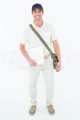 Happy courier man holding envelops