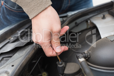 Man checking the engine of his car