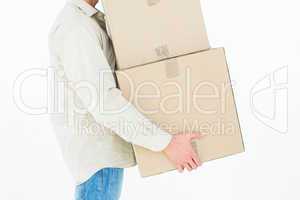 Delivery man carrying cardboard boxes