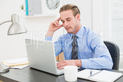 Businessman sleeping at his desk