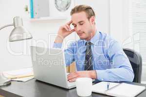 Businessman sleeping at his desk