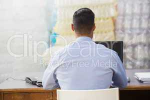 Warehouse manager working on computer