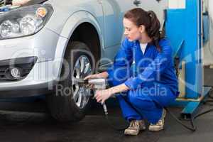 Mechanic adjusting the tire wheel