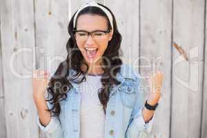 Pretty hipster cheering and smiling