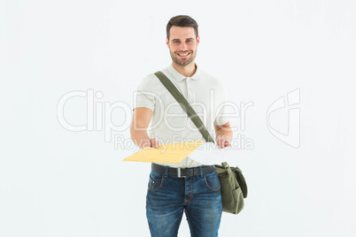 Happy courier man giving envelops