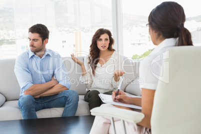 Couple quarreling in front of their therapist