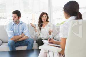 Couple quarreling in front of their therapist