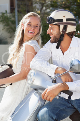 Cute couple with their scooter